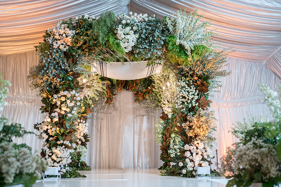 A floral arch at Neda and Michael's wedding at Four Seasons Westlake Village 