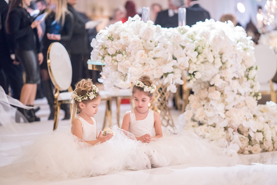 The flower girls take a rest at Michael and Neda's wedding at Four Seasons Westlake Village