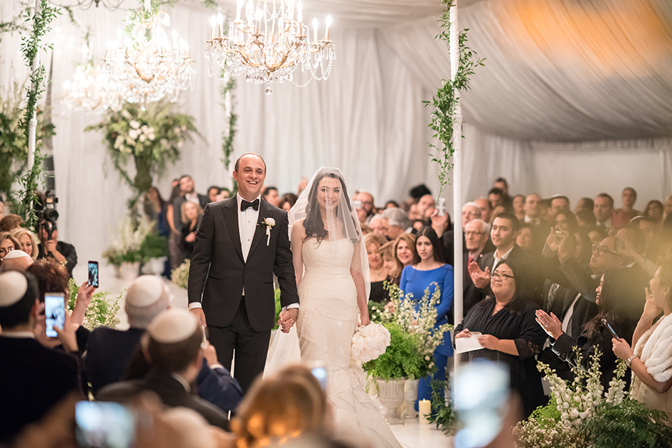 Michael and Neda walk down the aisle at their wedding at Four Seasons Westlake Village wedding.